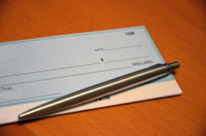 checkbook with a pen